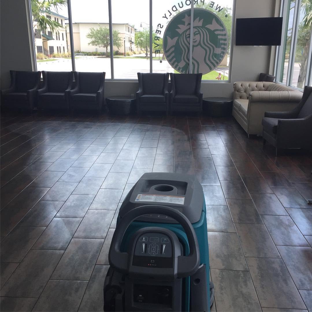 Hard floor scrubber on restored commercial tile at FGCU