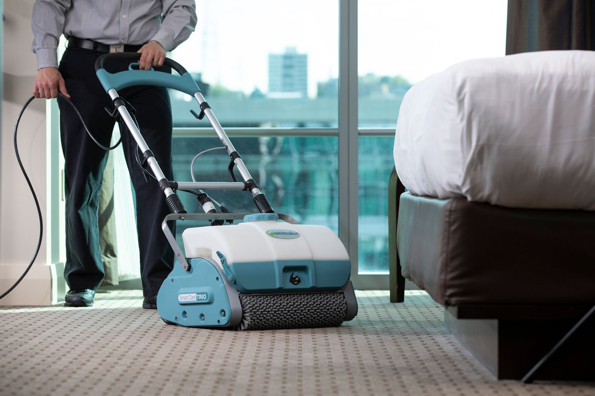 Mission Floor Care technician cleaning commercial carpet